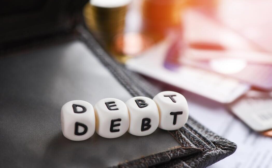 debt-credit-card-and-money-coin-stack-increased-liabilities-from-exemption-debt-consolidation-free-photo